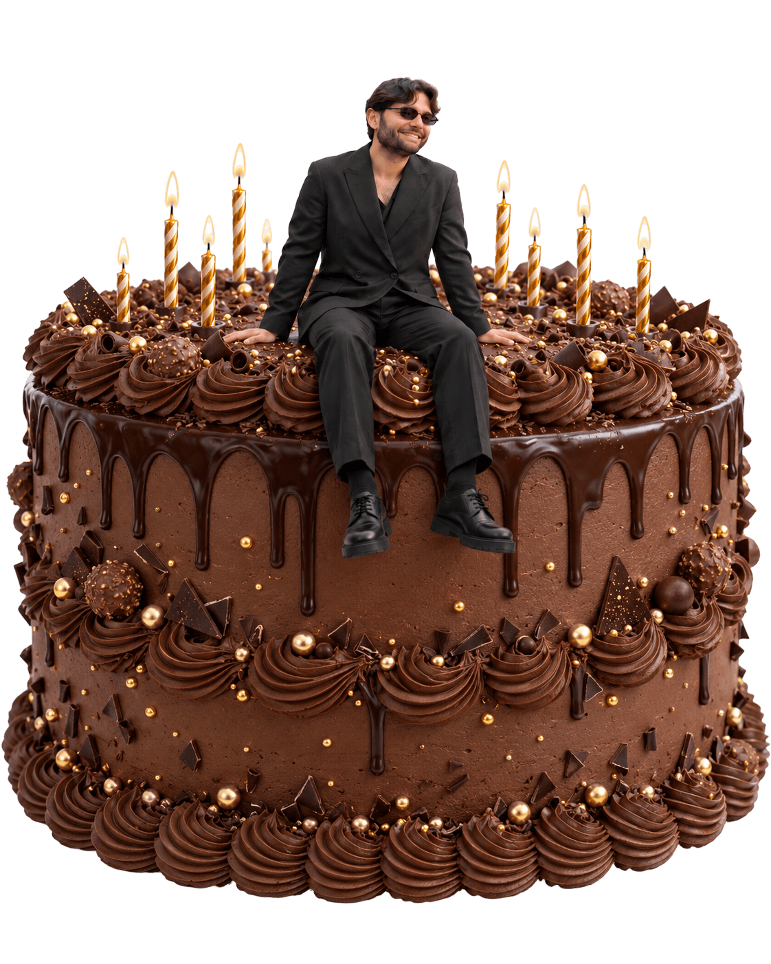 Gosha in a black suit sitting on a giant chocolate birthday cake